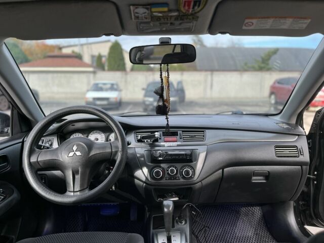 Чорний Міцубісі Lancer, об'ємом двигуна 1.6 л та пробігом 250 тис. км за 4800 $, фото 7 на Automoto.ua