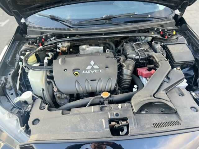 Черный Мицубиси Лансер, объемом двигателя 2 л и пробегом 170 тыс. км за 7900 $, фото 10 на Automoto.ua