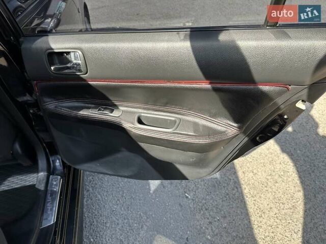 Черный Мицубиси Лансер, объемом двигателя 2 л и пробегом 272 тыс. км за 5514 $, фото 12 на Automoto.ua