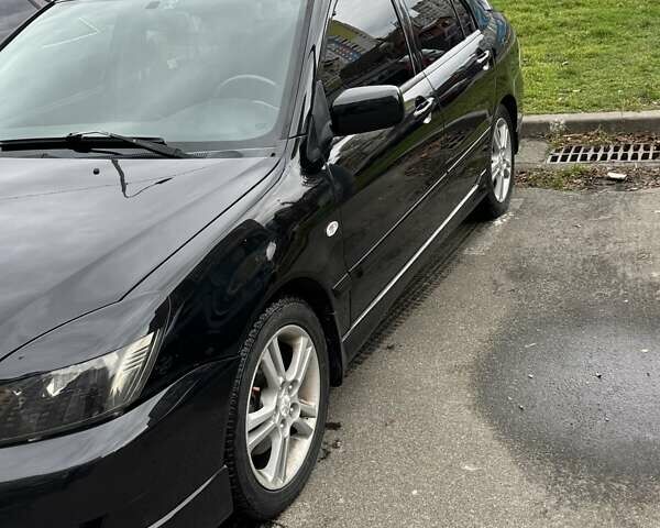 Черный Мицубиси Лансер, объемом двигателя 2 л и пробегом 219 тыс. км за 4400 $, фото 10 на Automoto.ua