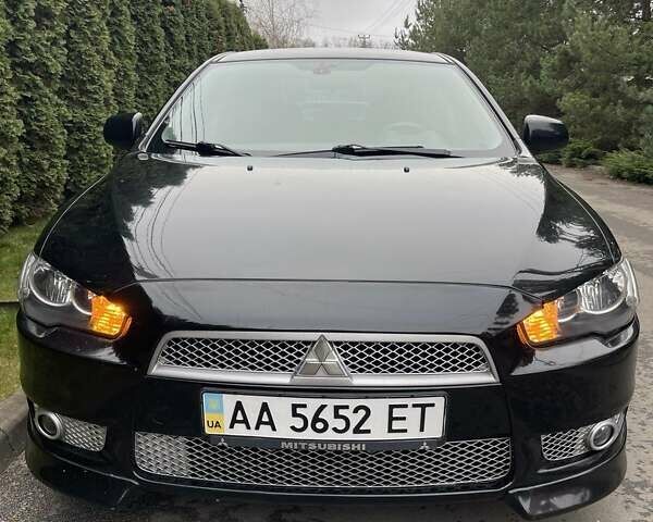 Чорний Міцубісі Lancer, об'ємом двигуна 2 л та пробігом 69 тис. км за 6200 $, фото 1 на Automoto.ua