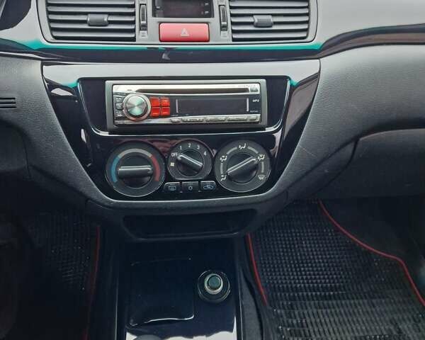 Чорний Міцубісі Lancer, об'ємом двигуна 1.6 л та пробігом 273 тис. км за 3999 $, фото 31 на Automoto.ua