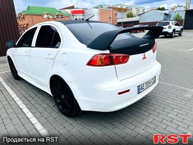 Черный Мицубиси Лансер, объемом двигателя 2 л и пробегом 195 тыс. км за 5500 $, фото 1 на Automoto.ua