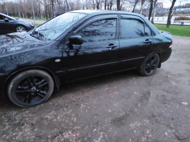 Чорний Міцубісі Lancer, об'ємом двигуна 1.6 л та пробігом 259 тис. км за 4500 $, фото 5 на Automoto.ua