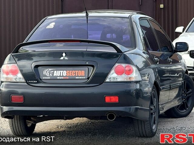 Черный Мицубиси Лансер, объемом двигателя 1.6 л и пробегом 260 тыс. км за 3700 $, фото 3 на Automoto.ua