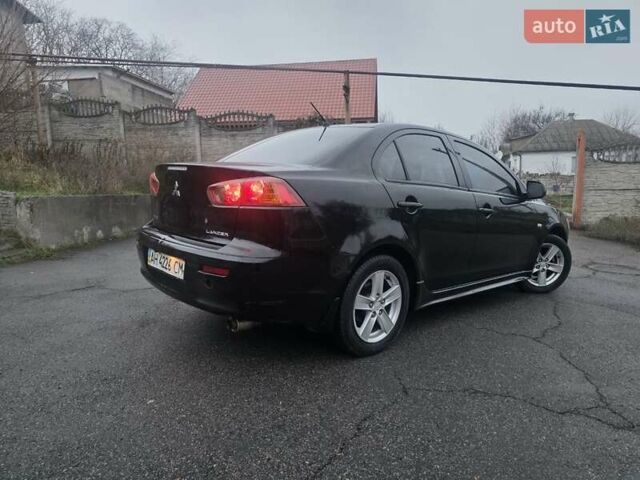 Черный Мицубиси Лансер, объемом двигателя 2 л и пробегом 116 тыс. км за 7200 $, фото 5 на Automoto.ua