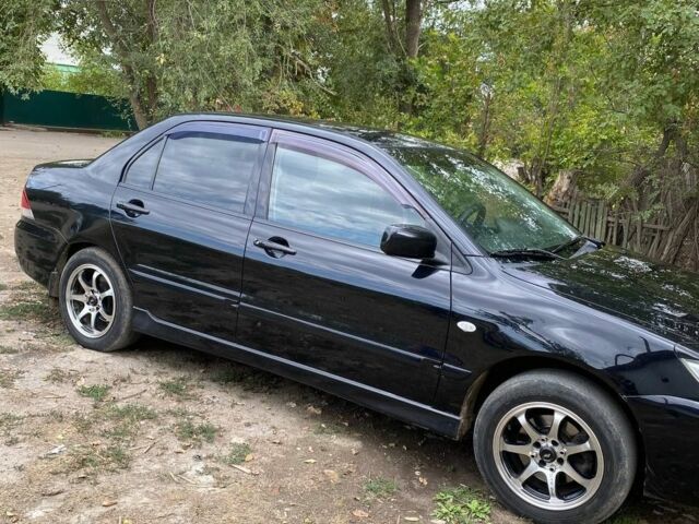 Черный Мицубиси Лансер, объемом двигателя 1.6 л и пробегом 232 тыс. км за 4200 $, фото 3 на Automoto.ua