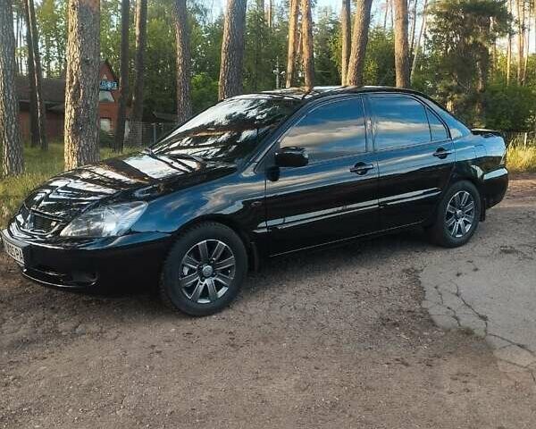 Черный Мицубиси Лансер, объемом двигателя 1.6 л и пробегом 270 тыс. км за 5200 $, фото 8 на Automoto.ua