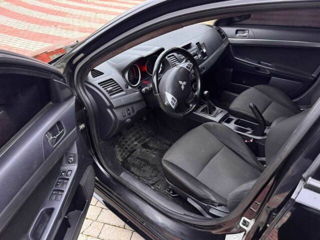 Черный Мицубиси Лансер, объемом двигателя 2 л и пробегом 217 тыс. км за 5500 $, фото 9 на Automoto.ua