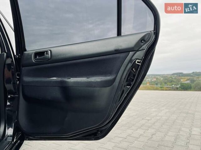 Чорний Міцубісі Lancer, об'ємом двигуна 1.6 л та пробігом 243 тис. км за 4950 $, фото 43 на Automoto.ua