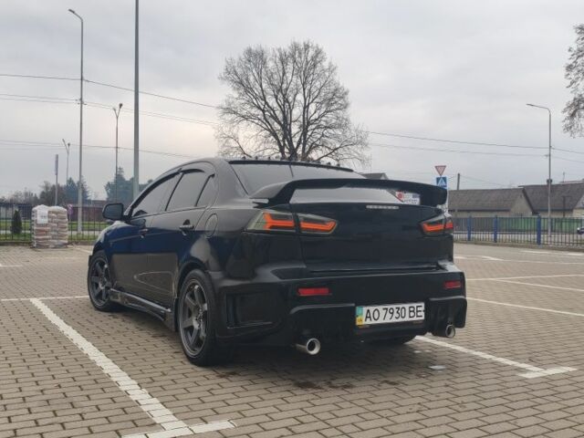 Черный Мицубиси Лансер, объемом двигателя 2 л и пробегом 160 тыс. км за 8000 $, фото 2 на Automoto.ua