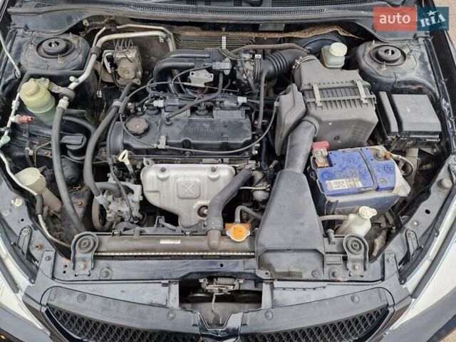 Чорний Міцубісі Lancer, об'ємом двигуна 1.6 л та пробігом 273 тис. км за 3999 $, фото 23 на Automoto.ua