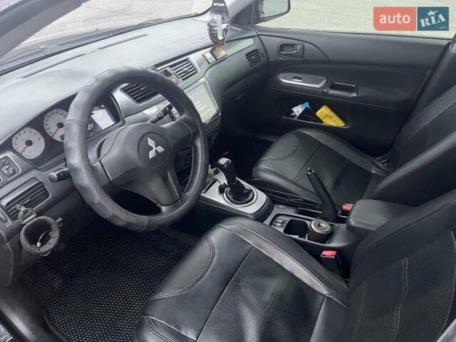 Чорний Міцубісі Lancer, об'ємом двигуна 1.58 л та пробігом 173 тис. км за 5099 $, фото 11 на Automoto.ua