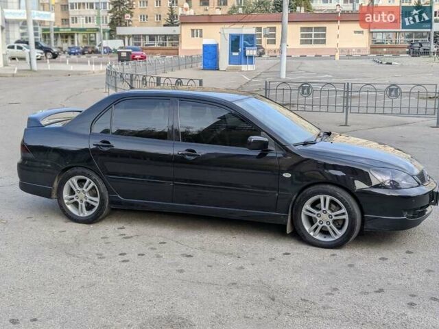 Чорний Міцубісі Lancer, об'ємом двигуна 2 л та пробігом 152 тис. км за 5500 $, фото 4 на Automoto.ua