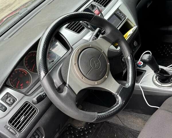 Черный Мицубиси Лансер, объемом двигателя 2 л и пробегом 219 тыс. км за 4400 $, фото 4 на Automoto.ua