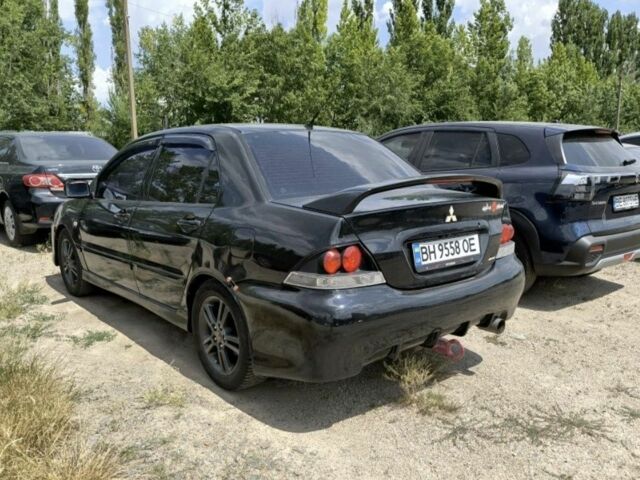 Черный Мицубиси Лансер, объемом двигателя 2 л и пробегом 161 тыс. км за 4500 $, фото 1 на Automoto.ua