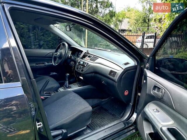 Черный Мицубиси Лансер, объемом двигателя 1.58 л и пробегом 200 тыс. км за 4000 $, фото 6 на Automoto.ua