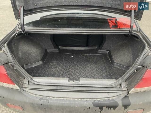 Черный Мицубиси Лансер, объемом двигателя 1.58 л и пробегом 263 тыс. км за 4000 $, фото 15 на Automoto.ua