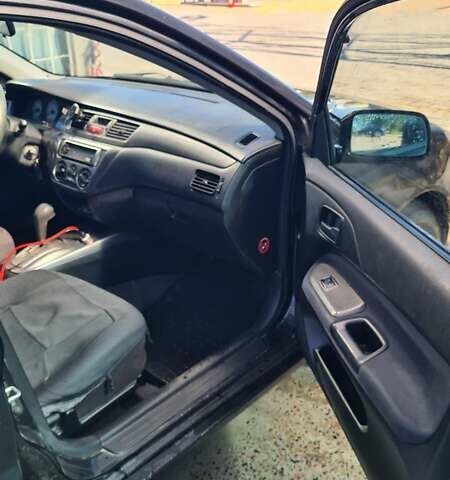 Чорний Міцубісі Lancer, об'ємом двигуна 1.6 л та пробігом 185 тис. км за 3300 $, фото 10 на Automoto.ua