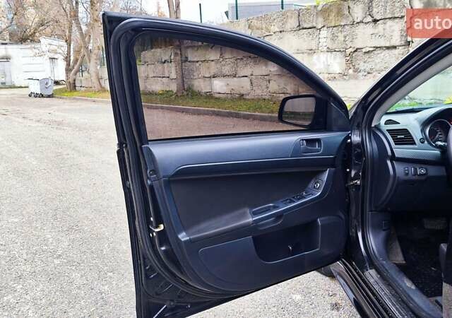 Черный Мицубиси Лансер, объемом двигателя 2 л и пробегом 230 тыс. км за 7100 $, фото 7 на Automoto.ua