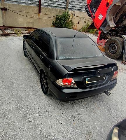 Чорний Міцубісі Lancer, об'ємом двигуна 2 л та пробігом 200 тис. км за 1800 $, фото 2 на Automoto.ua