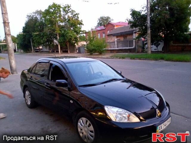 Черный Мицубиси Лансер, объемом двигателя 1.6 л и пробегом 247 тыс. км за 4000 $, фото 3 на Automoto.ua