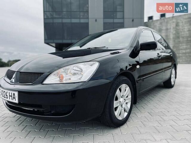 Чорний Міцубісі Lancer, об'ємом двигуна 1.6 л та пробігом 243 тис. км за 4950 $, фото 6 на Automoto.ua