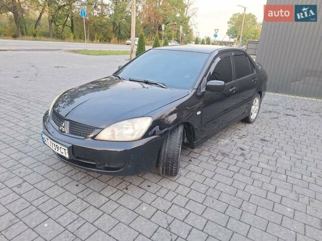 Черный Мицубиси Лансер, объемом двигателя 2 л и пробегом 300 тыс. км за 3200 $, фото 12 на Automoto.ua