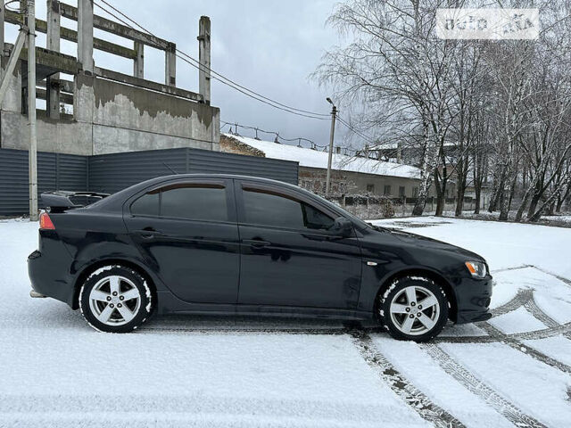 Чорний Міцубісі Lancer, об'ємом двигуна 2 л та пробігом 199 тис. км за 7000 $, фото 4 на Automoto.ua