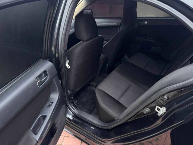 Черный Мицубиси Лансер, объемом двигателя 2 л и пробегом 217 тыс. км за 5500 $, фото 10 на Automoto.ua