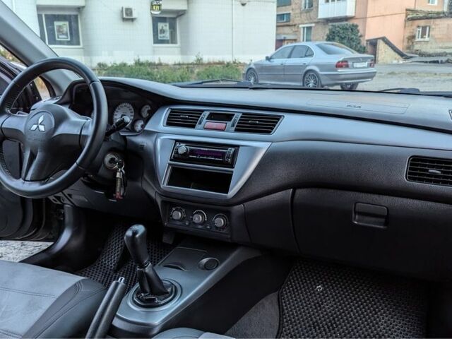 Черный Мицубиси Лансер, объемом двигателя 1.6 л и пробегом 226 тыс. км за 4800 $, фото 7 на Automoto.ua