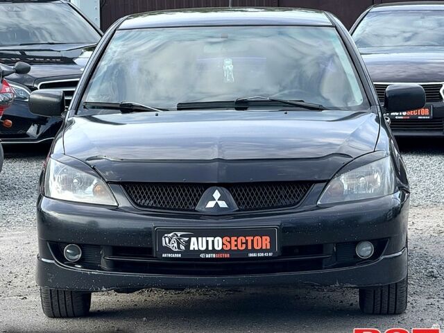 Черный Мицубиси Лансер, объемом двигателя 1.6 л и пробегом 260 тыс. км за 3700 $, фото 4 на Automoto.ua