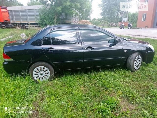 Чорний Міцубісі Lancer, об'ємом двигуна 1.58 л та пробігом 400 тис. км за 3700 $, фото 25 на Automoto.ua