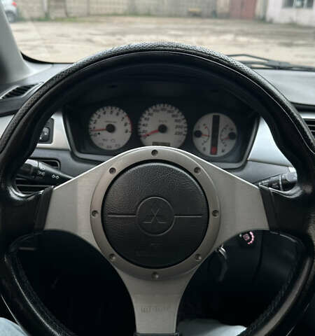 Черный Мицубиси Лансер, объемом двигателя 2 л и пробегом 143 тыс. км за 4999 $, фото 9 на Automoto.ua