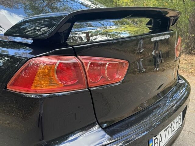 Черный Мицубиси Лансер, объемом двигателя 2 л и пробегом 280 тыс. км за 6800 $, фото 1 на Automoto.ua