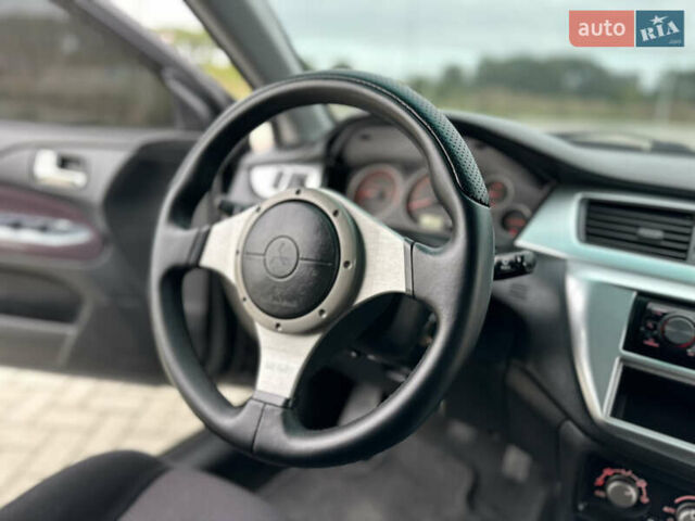 Чорний Міцубісі Lancer, об'ємом двигуна 2 л та пробігом 275 тис. км за 5300 $, фото 48 на Automoto.ua