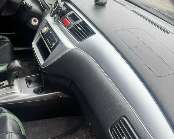 Чорний Міцубісі Lancer, об'ємом двигуна 2 л та пробігом 210 тис. км за 5500 $, фото 28 на Automoto.ua