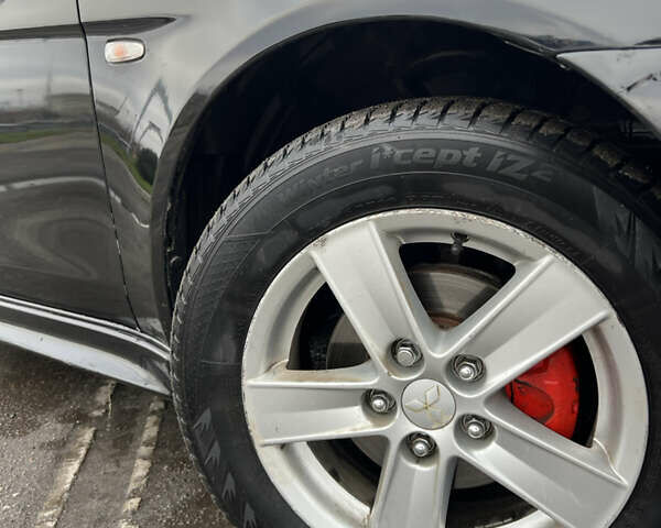 Черный Мицубиси Лансер, объемом двигателя 2 л и пробегом 350 тыс. км за 6700 $, фото 7 на Automoto.ua