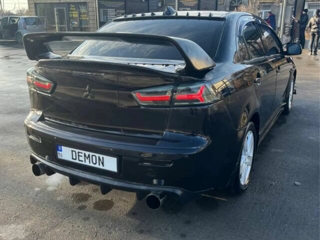 Чорний Міцубісі Lancer, об'ємом двигуна 2 л та пробігом 226 тис. км за 6700 $, фото 1 на Automoto.ua