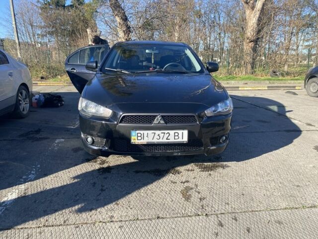 Черный Мицубиси Лансер, объемом двигателя 2 л и пробегом 372 тыс. км за 6200 $, фото 1 на Automoto.ua