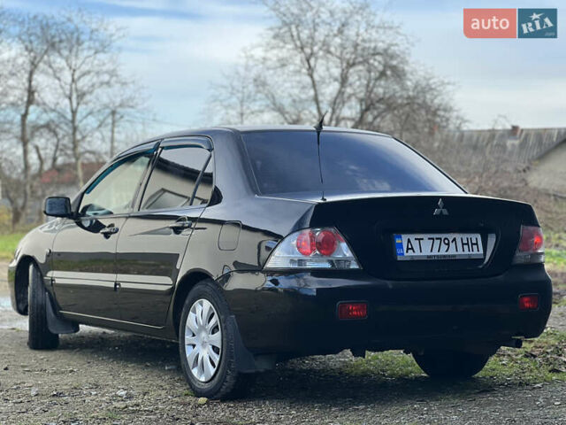 Чорний Міцубісі Lancer, об'ємом двигуна 1.58 л та пробігом 185 тис. км за 3750 $, фото 3 на Automoto.ua