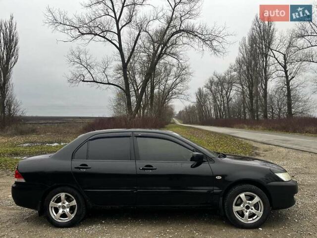 Черный Мицубиси Лансер, объемом двигателя 1.6 л и пробегом 272 тыс. км за 2800 $, фото 4 на Automoto.ua