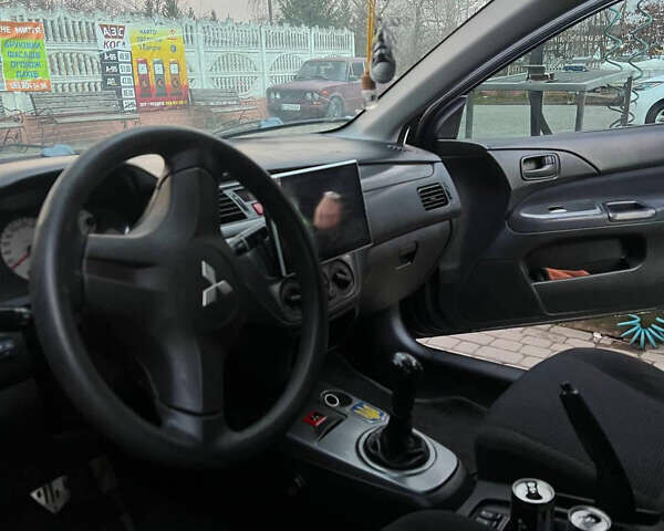 Черный Мицубиси Лансер, объемом двигателя 1.6 л и пробегом 180 тыс. км за 3499 $, фото 14 на Automoto.ua