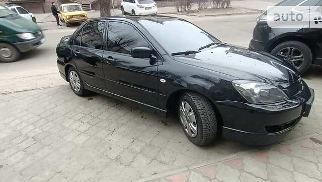 Чорний Міцубісі Lancer, об'ємом двигуна 2 л та пробігом 282 тис. км за 5700 $, фото 3 на Automoto.ua