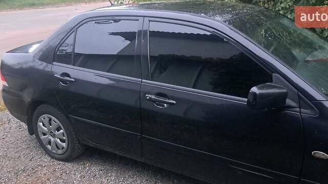 Чорний Міцубісі Lancer, об'ємом двигуна 1.6 л та пробігом 234 тис. км за 3900 $, фото 3 на Automoto.ua