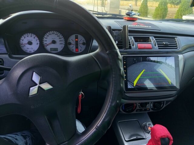 Чорний Міцубісі Lancer, об'ємом двигуна 1.6 л та пробігом 3 тис. км за 4500 $, фото 10 на Automoto.ua