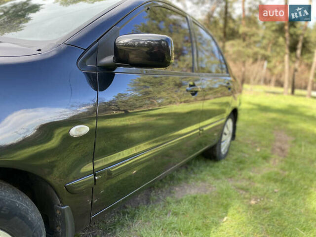Чорний Міцубісі Lancer, об'ємом двигуна 1.6 л та пробігом 224 тис. км за 4950 $, фото 13 на Automoto.ua
