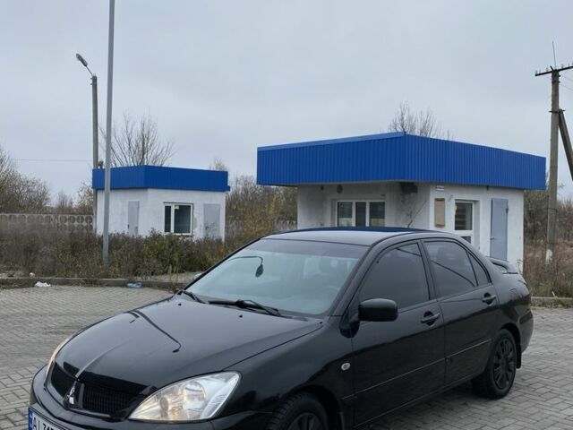 Черный Мицубиси Лансер, объемом двигателя 1.6 л и пробегом 263 тыс. км за 2900 $, фото 1 на Automoto.ua