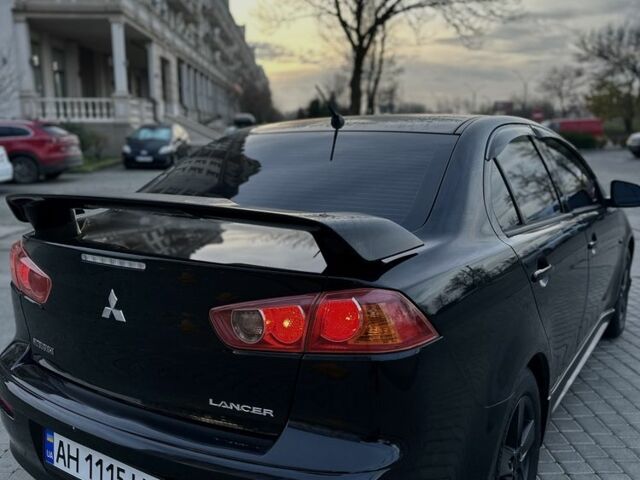 Черный Мицубиси Лансер, объемом двигателя 2 л и пробегом 242 тыс. км за 6200 $, фото 11 на Automoto.ua