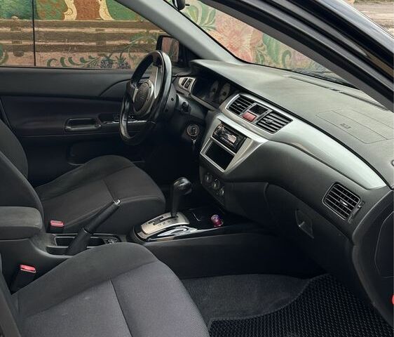 Чорний Міцубісі Lancer, об'ємом двигуна 2 л та пробігом 143 тис. км за 5400 $, фото 5 на Automoto.ua